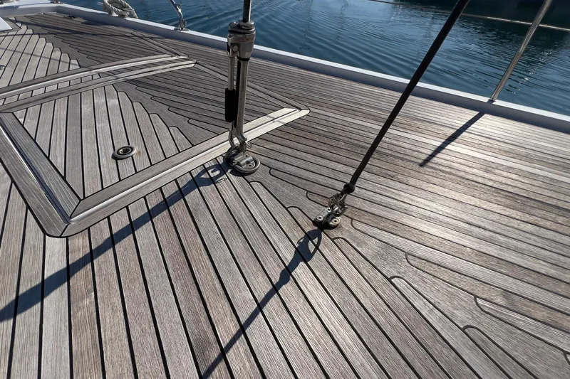  Yacht Photos Pics Teak deck of 2012 Grand Soleil 50 yacht with metal fittings and clear blue water.