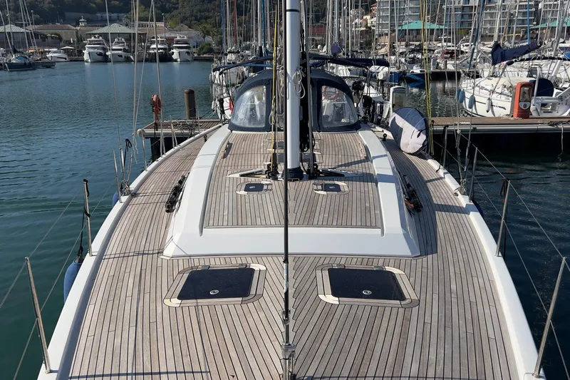  Yacht Photos Pics 2012 Grand Soleil 50 yacht docked in marina, showcasing sleek wooden deck design.