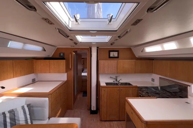  Yacht Photos Pics Interior of 2012 Grand Soleil 50 yacht, featuring modern kitchen and skylights.