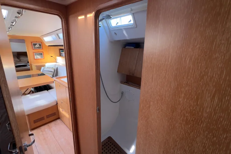  Yacht Photos Pics Interior of 2012 Grand Soleil 50 yacht, featuring cozy cabin and wooden finishes.