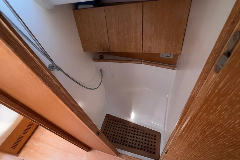  Yacht Photos Pics Shower area in 2012 Grand Soleil 50 yacht with wooden cabinetry and flooring.