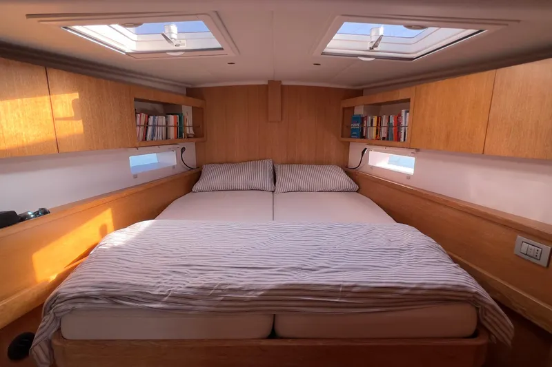  Yacht Photos Pics Luxurious cabin interior of 2012 Grand Soleil 50 yacht with skylights and wooden finish.