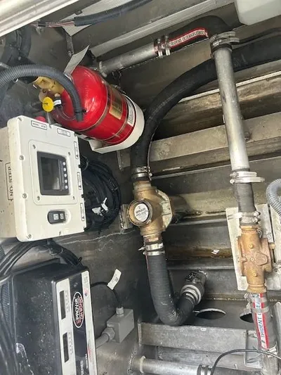 Penelope Yacht Photos Pics Engine compartment of 2023 Smoky Mountain catamaran with fire extinguisher and control panel.