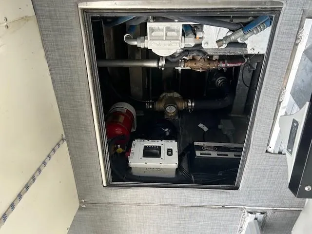 Penelope Yacht Photos Pics Engine compartment of 2023 Smoky Mountain asymmetrical foil-assisted catamaran, showing mechanical components.