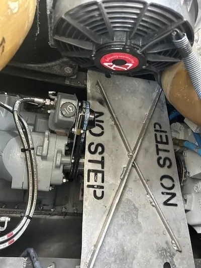 Penelope Yacht Photos Pics Engine compartment of 2023 Smoky Mountain catamaran with "No Step" warning sign.