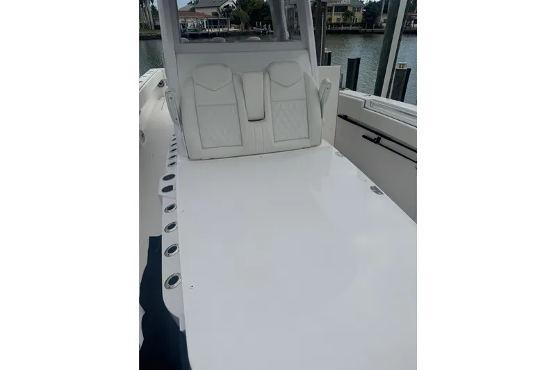  Yacht Photos Pics 2024 Invincible 39 Open Fisherman boat interior with white seating and rod holders.