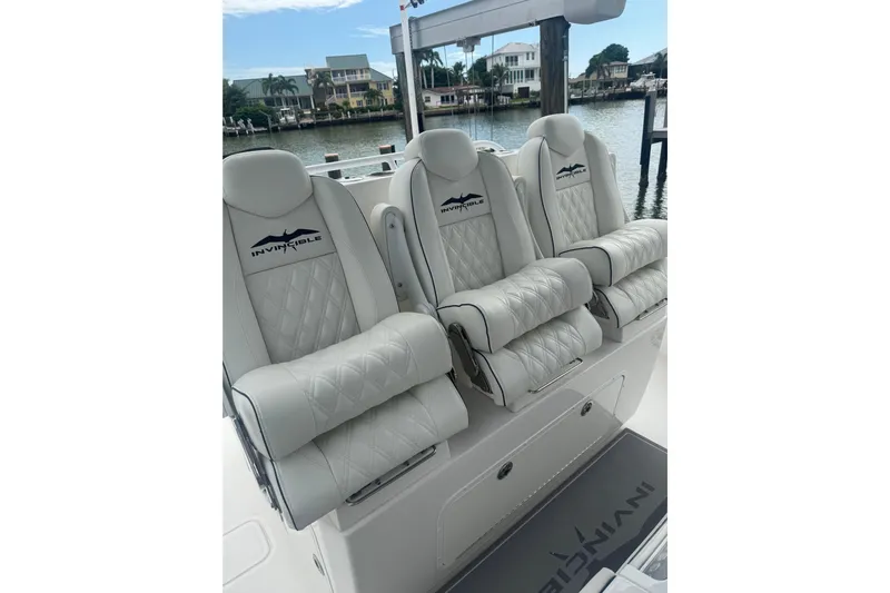  Yacht Photos Pics 2024 Invincible 39 Open Fisherman boat seats with luxurious white upholstery.