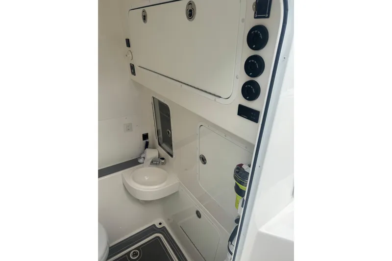  Yacht Photos Pics 2024 Invincible 39 Open Fisherman boat interior with sink and storage compartments.