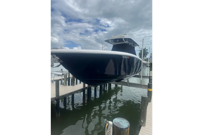  Yacht Photos Pics 2024 Invincible 39 Open Fisherman boat docked, showcasing sleek design and modern features.