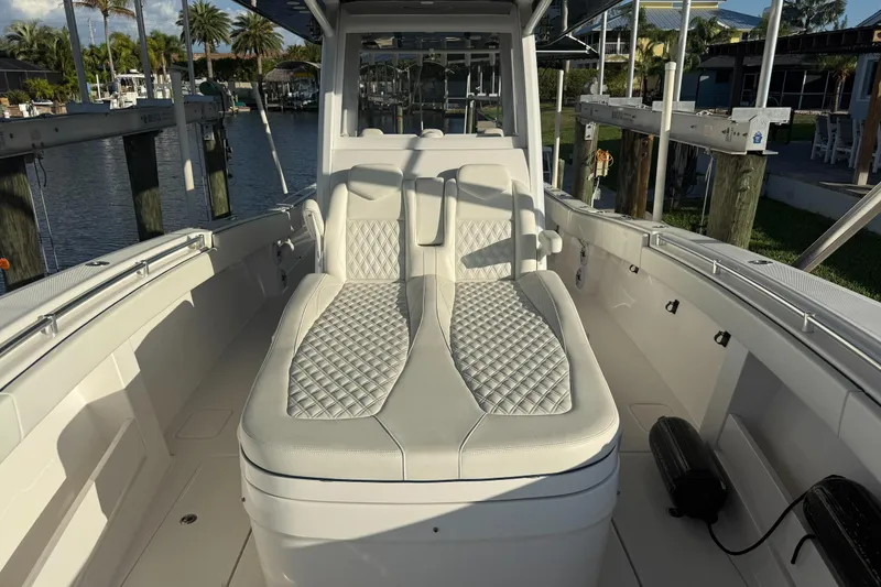  Yacht Photos Pics 2024 Invincible 39 Open Fisherman boat interior with luxurious seating and waterfront view.