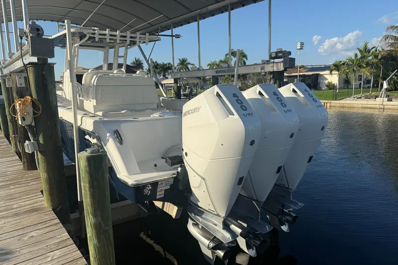  Yacht Photos Pics 2024 Invincible 39 Open Fisherman boat with triple Mercury 400 engines docked.