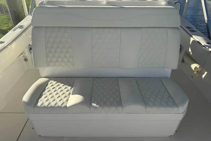  Yacht Photos Pics 2024 Invincible 39 Open Fisherman boat seat with diamond-patterned upholstery.