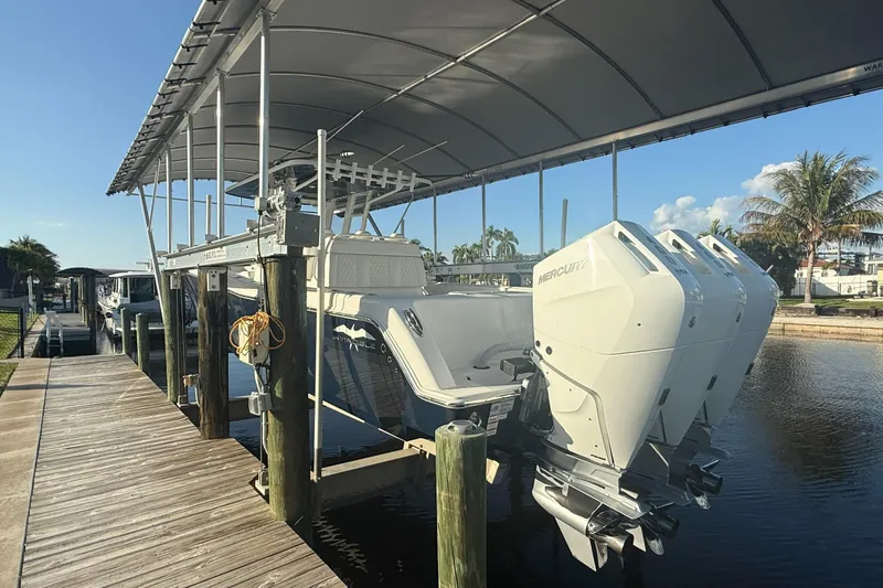  Yacht Photos Pics 2024 Invincible 39 Open Fisherman boat docked with triple Mercury engines.