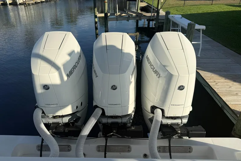  Yacht Photos Pics Triple Mercury Verado engines on a 2024 Invincible 39 Open Fisherman boat at dock.