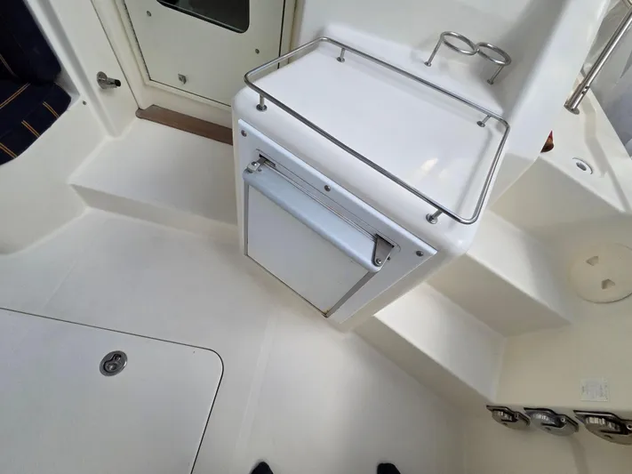 Escapade Yacht Photos Pics 2007 Sabre 34 Hardtop Express interior with white cabinetry and seating area.