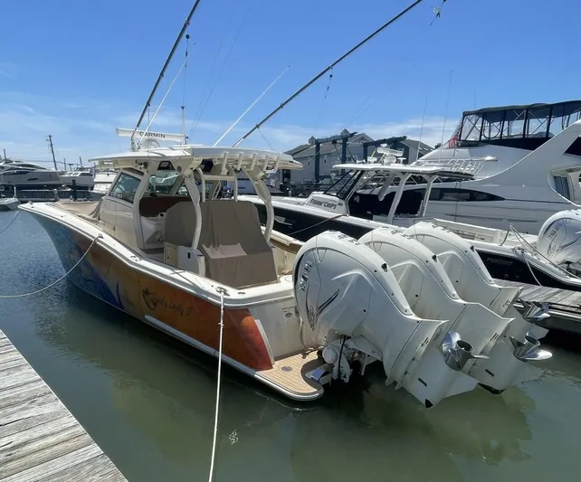 Shady Lady 2 Yacht Photos Pics 2019 Scout 380LXF boat docked with triple outboard engines.