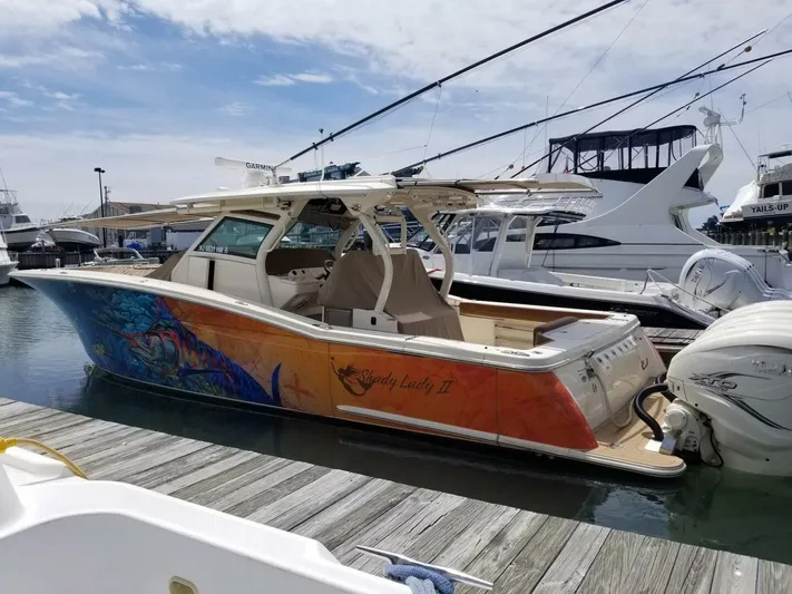 Shady Lady 2 Yacht Photos Pics 2019 Scout 380LXF boat docked with colorful artwork.