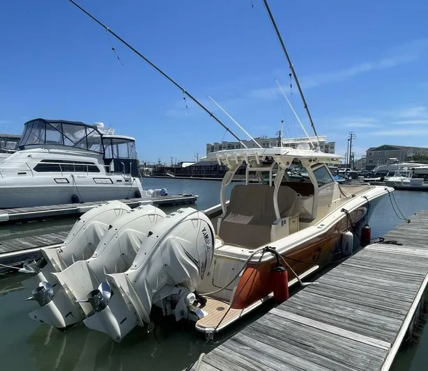 Shady Lady 2 Yacht Photos Pics 2019 Scout 380LXF boat docked with triple outboard engines.