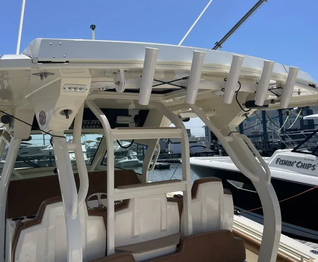 Shady Lady 2 Yacht Photos Pics Scout 380LXF 2019 boat with fishing rod holders in harbor.
