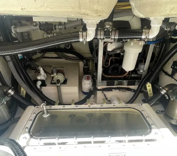 Shady Lady 2 Yacht Photos Pics Engine compartment of 2019 Scout 380LXF boat with hoses and filters.