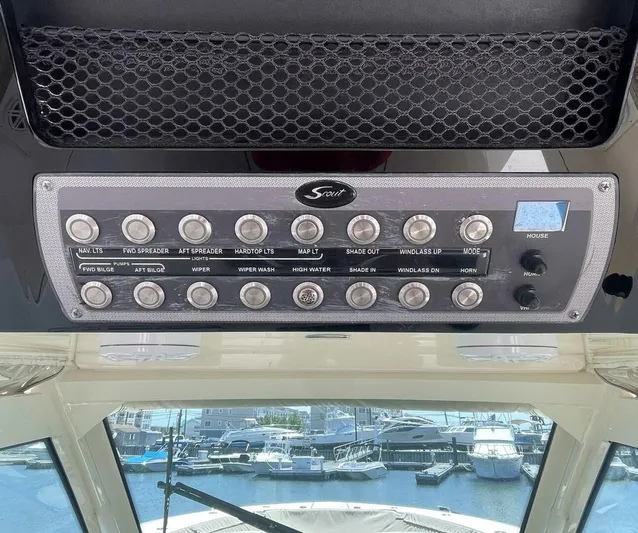 Shady Lady 2 Yacht Photos Pics Control panel of a 2019 Scout 380LXF boat in harbor.