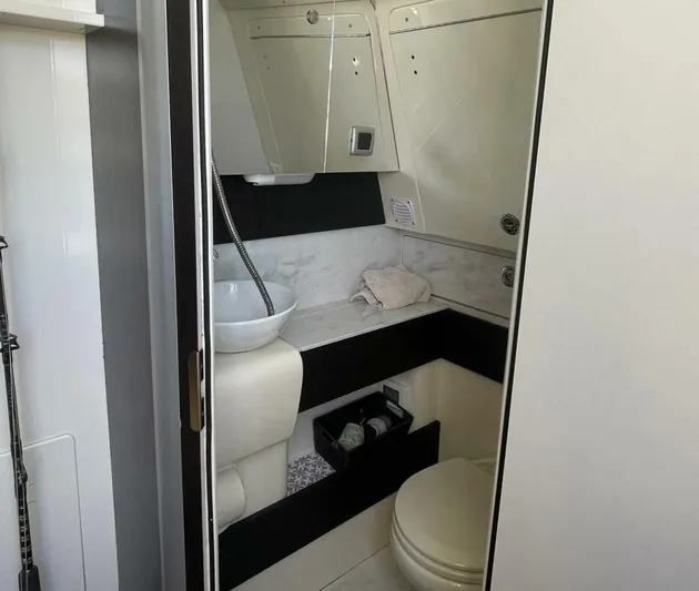 Shady Lady 2 Yacht Photos Pics Interior of 2019 Scout 380LXF featuring bathroom.