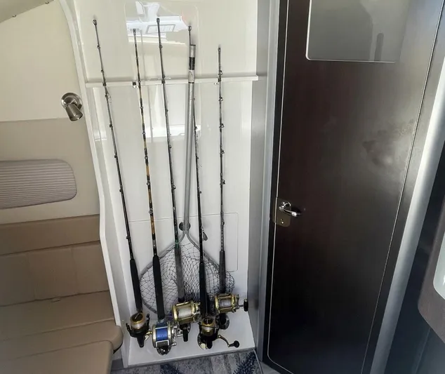Shady Lady 2 Yacht Photos Pics Fishing rods inside a 2019 Scout 380LXF boat interior.