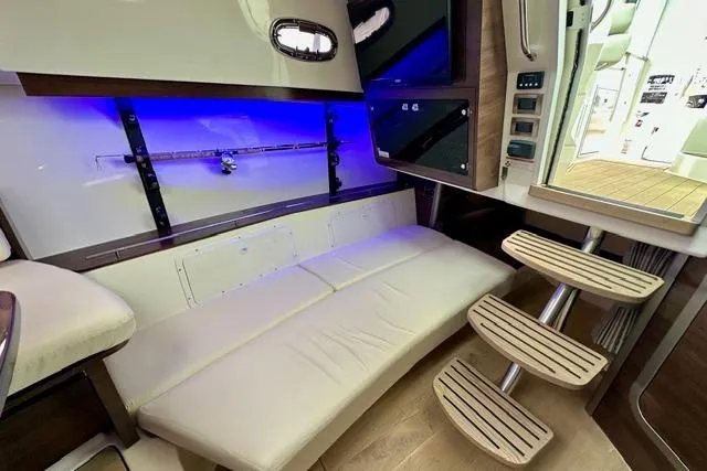  Yacht Photos Pics Interior of 2021 Boston Whaler 345 Conquest Pilothouse with seating and modern lighting.