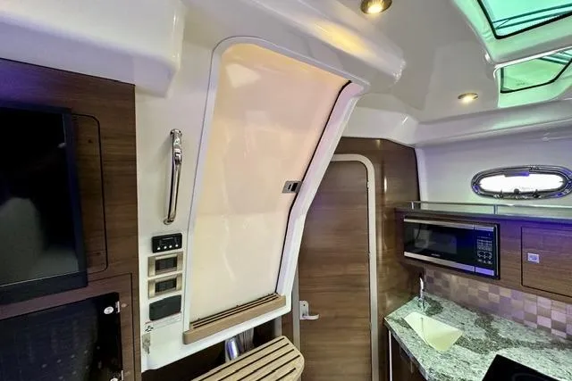  Yacht Photos Pics Interior of 2021 Boston Whaler 345 Conquest Pilothouse with modern kitchen amenities.