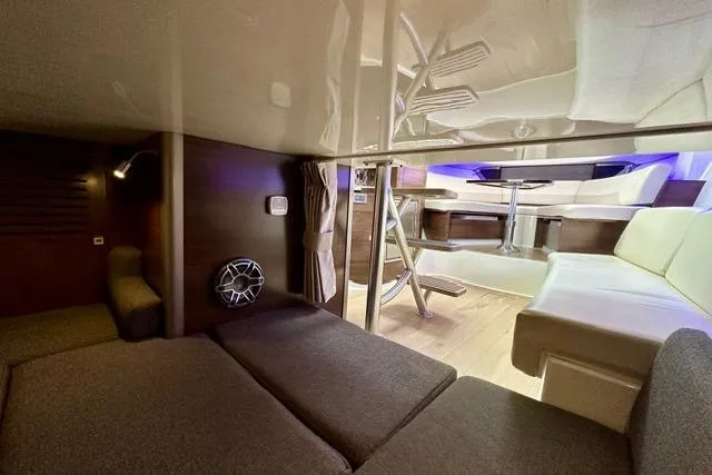  Yacht Photos Pics Interior of 2021 Boston Whaler 345 Conquest Pilothouse, featuring cozy seating and modern design.