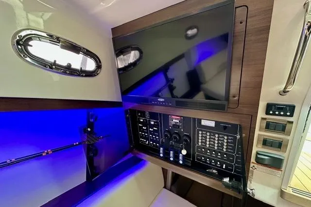  Yacht Photos Pics 2021 Boston Whaler 345 Conquest Pilothouse interior with control panel and screen.