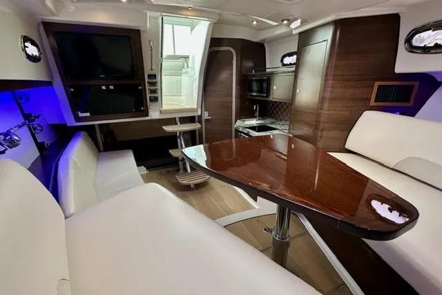  Yacht Photos Pics 2021 Boston Whaler 345 Conquest Pilothouse interior with elegant seating and modern amenities.