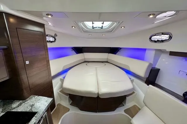  Yacht Photos Pics Luxurious interior of 2021 Boston Whaler 345 Conquest Pilothouse with plush seating and ambient lighting.