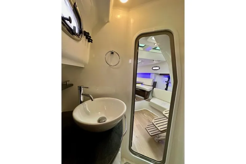  Yacht Photos Pics Interior of 2021 Boston Whaler 345 Conquest Pilothouse, featuring modern sink and seating area.
