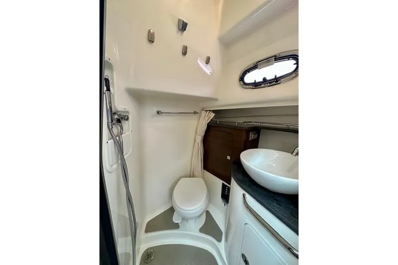  Yacht Photos Pics 2021 Boston Whaler 345 Conquest Pilothouse bathroom with toilet, sink, and shower.