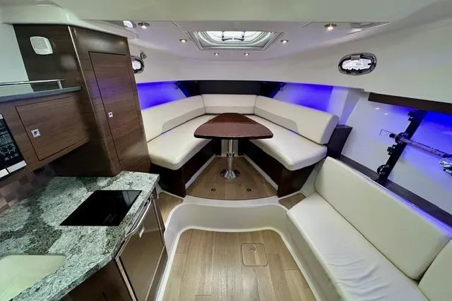  Yacht Photos Pics Interior of 2021 Boston Whaler 345 Conquest Pilothouse with modern seating and ambient lighting.