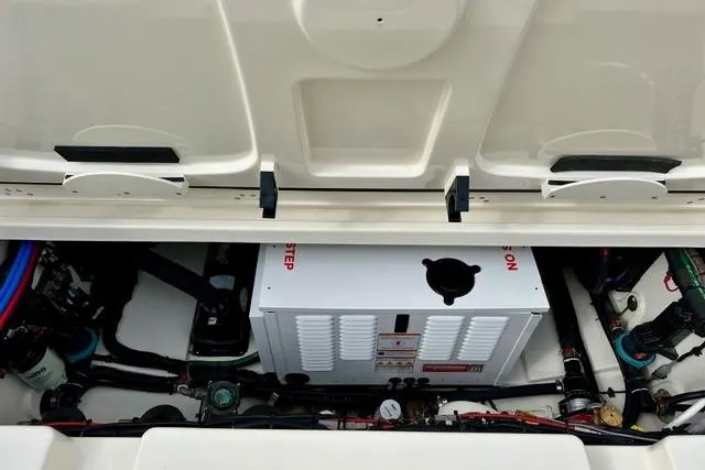  Yacht Photos Pics 2021 Boston Whaler 345 Conquest Pilothouse engine compartment with visible components and wiring.