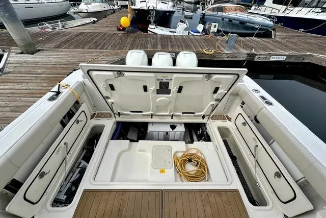  Yacht Photos Pics 2021 Boston Whaler 345 Conquest Pilothouse boat interior with open storage compartments.