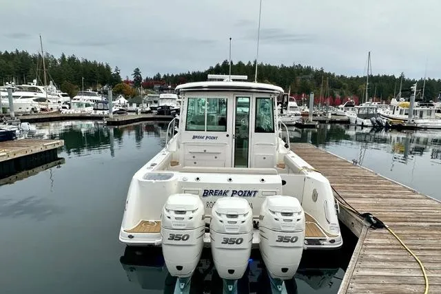  Yacht Photos Pics 2021 Boston Whaler 345 Conquest Pilothouse docked with triple 350 engines.