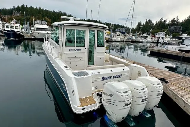  Yacht Photos Pics 2021 Boston Whaler 345 Conquest Pilothouse docked with triple Mercury 350 engines.