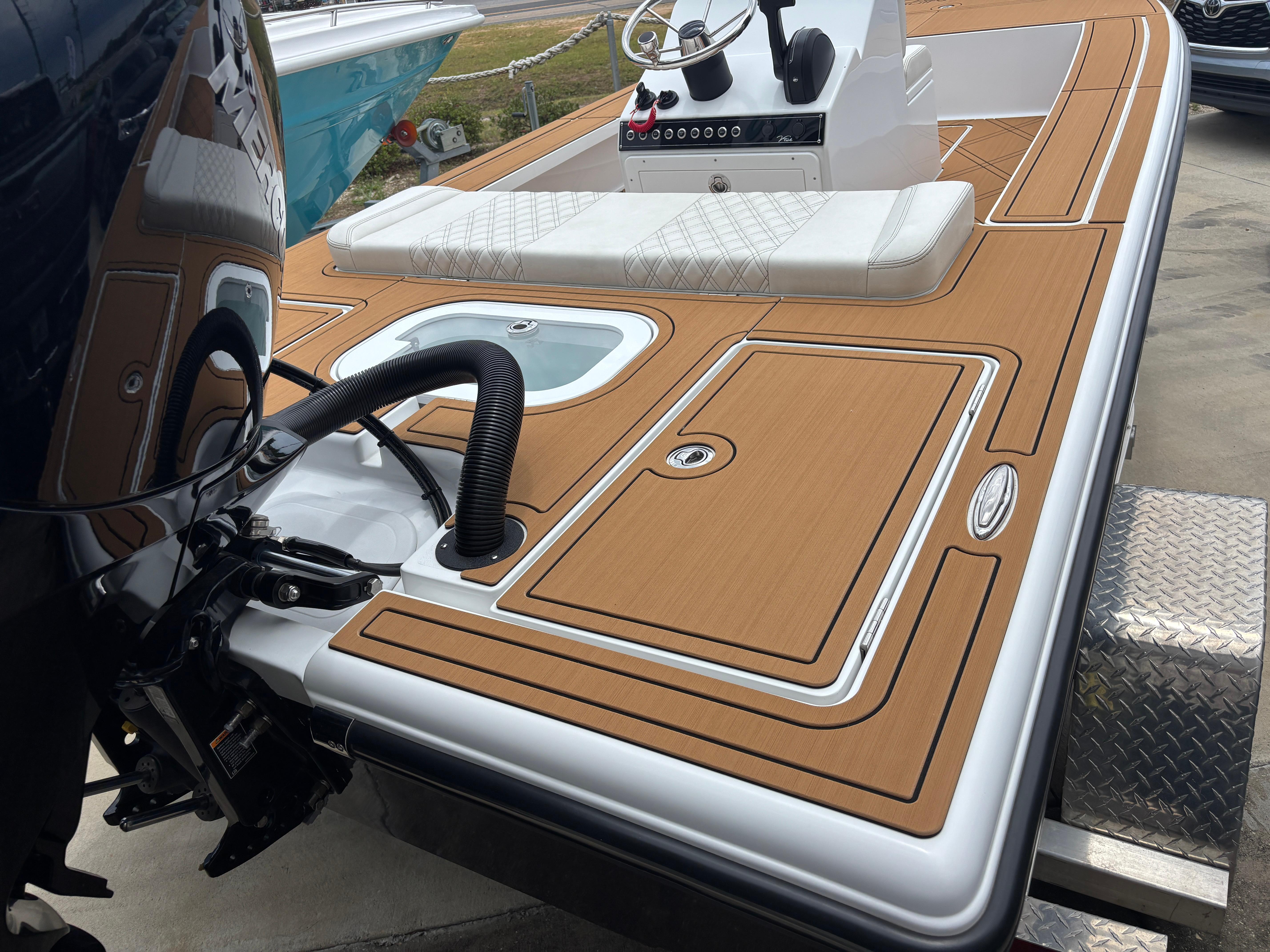 2024 Vtech 18 FLATS boat with sleek deck design and modern controls.