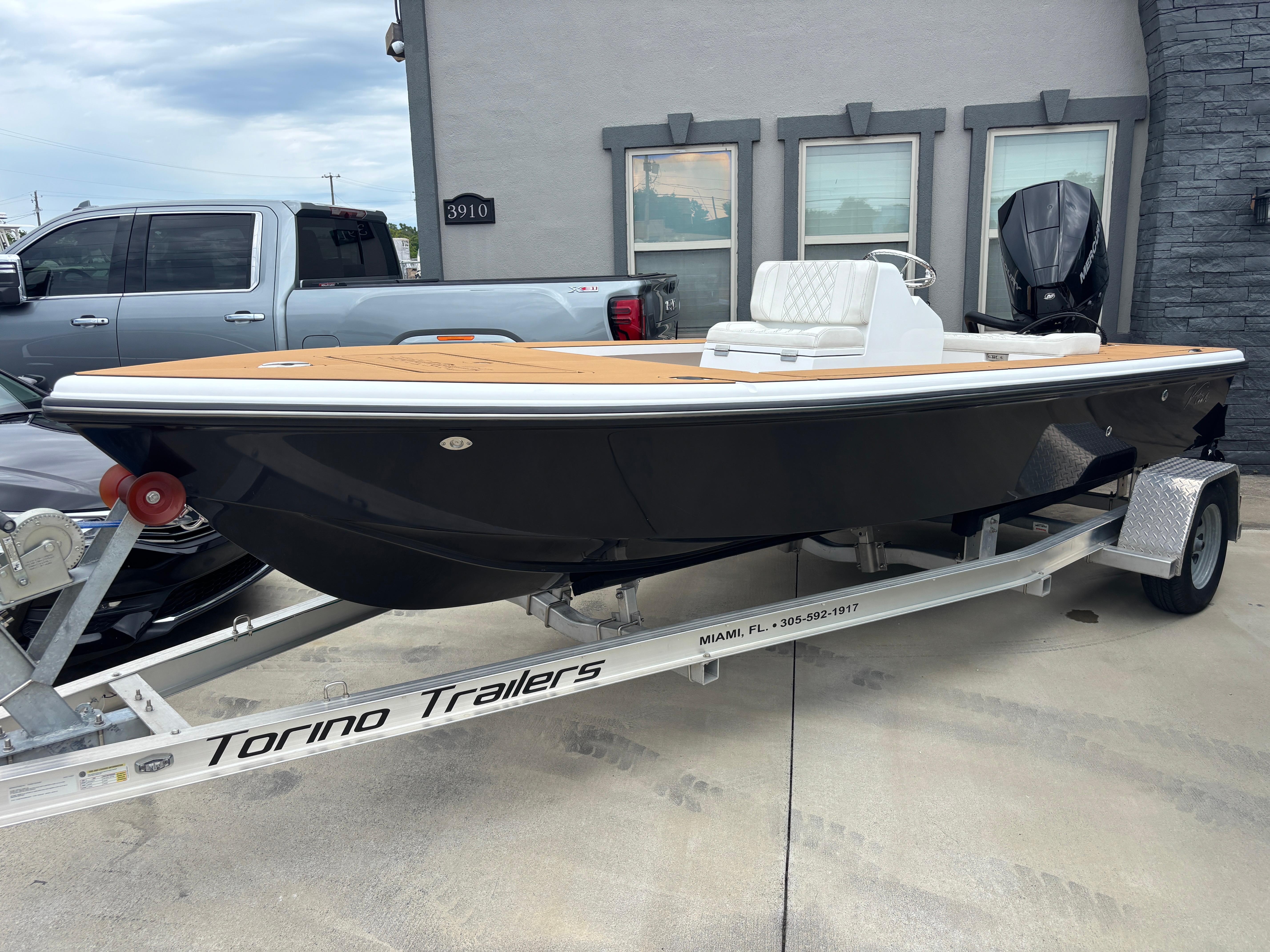 2024 Vtech 18 FLATS boat on Torino trailer, parked outdoors.