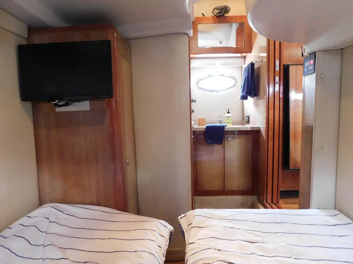 Sea Y'all Yacht Photos Pics Interior of 2004 Regal Commodore 3860 yacht with twin beds and bathroom.