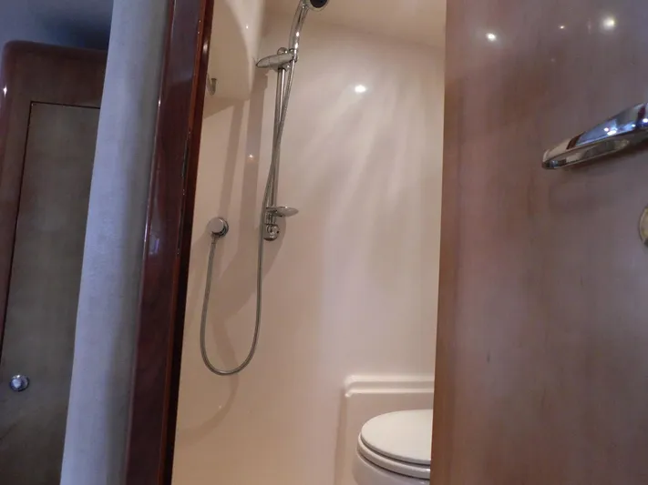 Sea Y'all Yacht Photos Pics Interior of 2004 Regal Commodore 3860 yacht bathroom with shower and toilet.