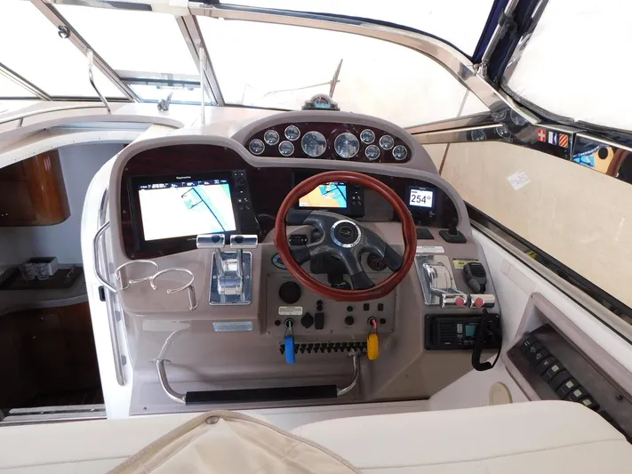 Sea Y'all Yacht Photos Pics 2004 Regal Commodore 3860 helm with navigation screens and controls.