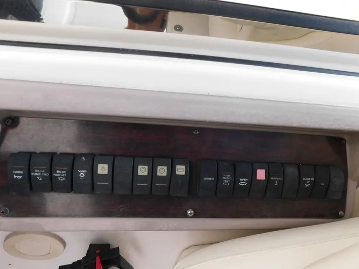 Sea Y'all Yacht Photos Pics Control panel of a 2004 Regal Commodore 3860 boat with labeled switches.