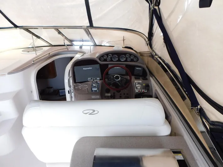 Sea Y'all Yacht Photos Pics Interior cockpit of 2004 Regal Commodore 3860 yacht with steering wheel and navigation equipment.