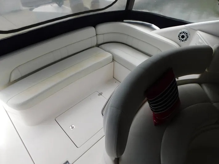 Sea Y'all Yacht Photos Pics 2004 Regal Commodore 3860 yacht interior with white seating and speaker.