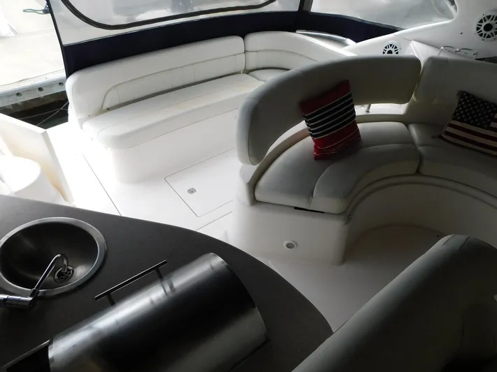 Sea Y'all Yacht Photos Pics Luxurious interior of 2004 Regal Commodore 3860 yacht with plush seating and decorative pillows.