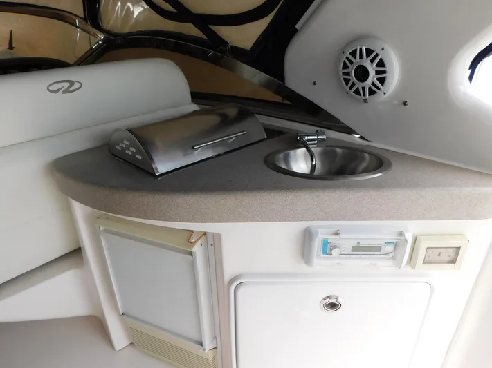 Sea Y'all Yacht Photos Pics 2004 Regal Commodore 3860 yacht interior with sink, grill, and speaker.